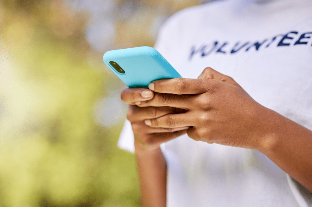 Volunteer using a cellphone