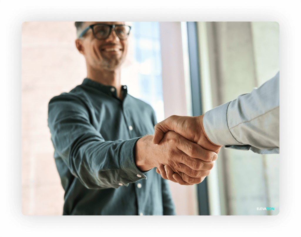 Business man shaking another business man's hand